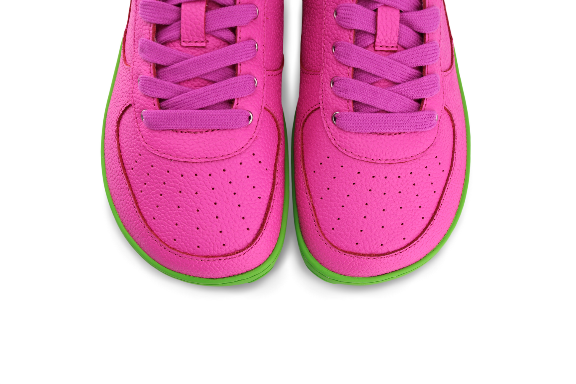 ABOVE VIEW OF BUBBLE LOW - BRIGHT PINK LEATHE BAREFOOT SNEAKERS ON GREEN SOLE